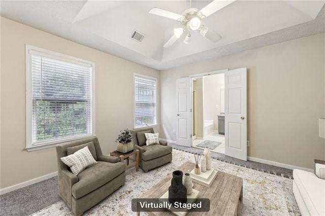 250 Kensington Trce, Stockbridge, GA 30281 - living room with a ceiling fan, a raised ceiling, and baseboards