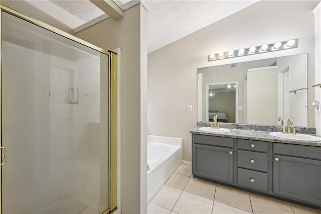 250 Kensington Trce, Stockbridge, GA 30281 - full bathroom with tile patterned floors, a shower stall, a bath, and double vanity