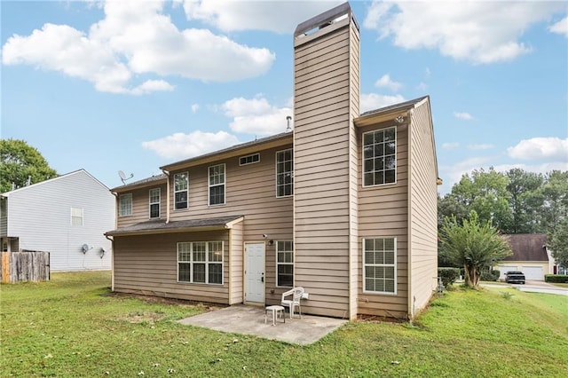 250 Kensington Trce, Stockbridge, GA 30281 - back of house with a chimney, a patio, and a yard