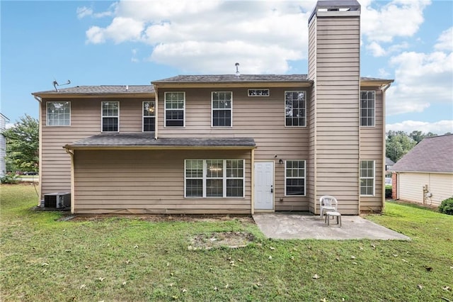 250 Kensington Trce, Stockbridge, GA 30281 - back of property with a patio, a yard, central air condition unit, and a chimney