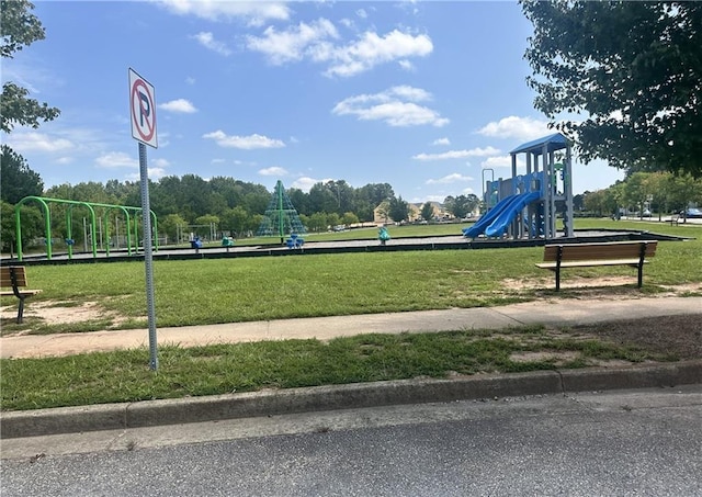 view of community featuring a lawn and playground community