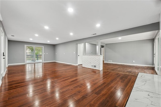 unfurnished living room featuring a fireplace and dark hardwood / wood-style flooring