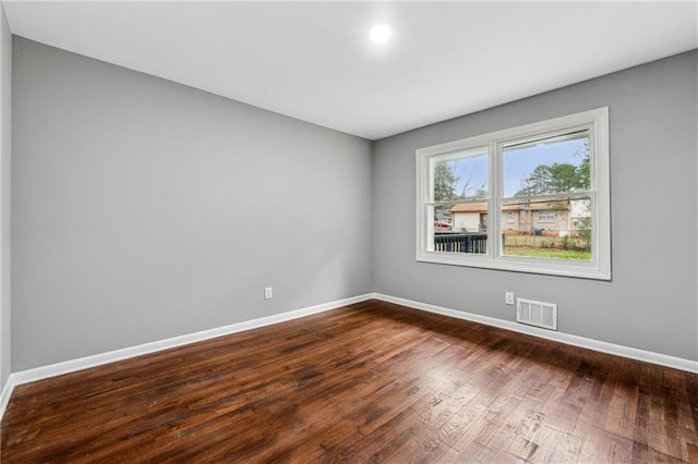 empty room featuring hardwood / wood-style flooring