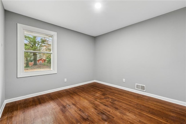 unfurnished room featuring wood-type flooring