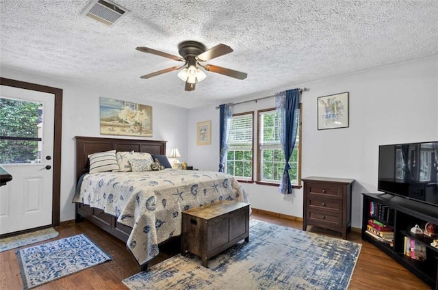 51 Ocoee Trl, Blue Ridge, GA 30513 - bedroom with a textured ceiling, wood finished floors, and a ceiling fan