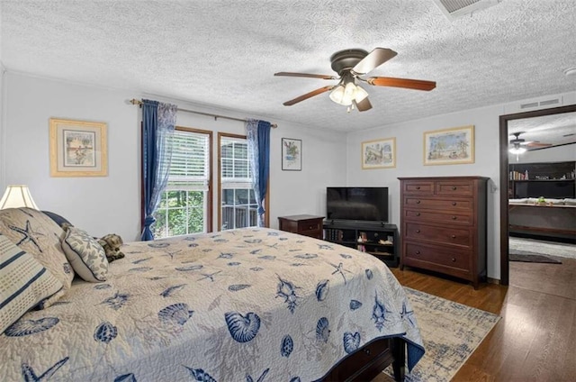 51 Ocoee Trl, Blue Ridge, GA 30513 - bedroom with wood finished floors, a textured ceiling, and ceiling fan