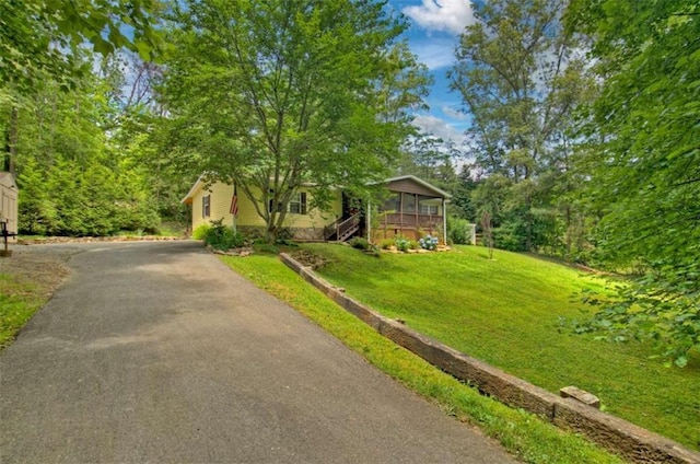 51 Ocoee Trl, Blue Ridge, GA 30513 - view of front of property with asphalt driveway, a front yard, and stairs