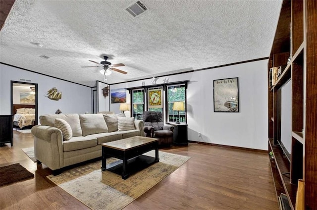51 Ocoee Trl, Blue Ridge, GA 30513 - living area featuring crown molding, a ceiling fan, a textured ceiling, and wood finished floors
