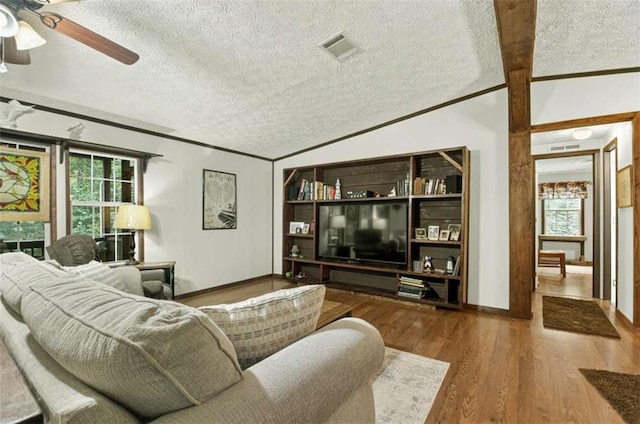 51 Ocoee Trl, Blue Ridge, GA 30513 - living area featuring a textured ceiling, a ceiling fan, lofted ceiling, wood finished floors, and crown molding