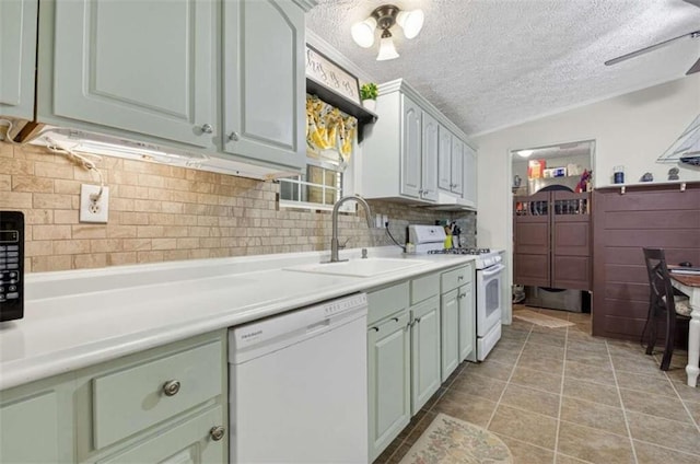 51 Ocoee Trl, Blue Ridge, GA 30513 - kitchen with white appliances, backsplash, a textured ceiling, light countertops, and light tile patterned floors