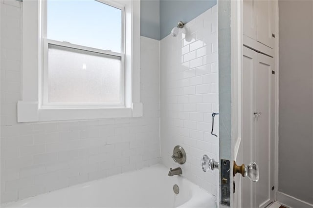 full bath with shower / bathtub combination and a healthy amount of sunlight