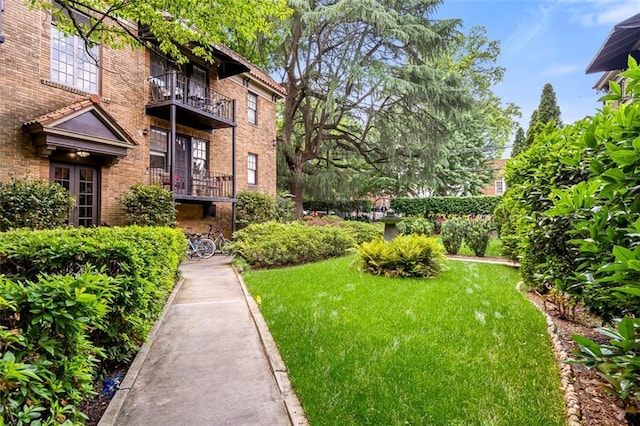 view of property's community with a lawn