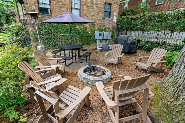 view of patio featuring an outdoor fire pit