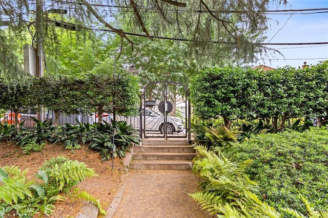view of home's community with fence