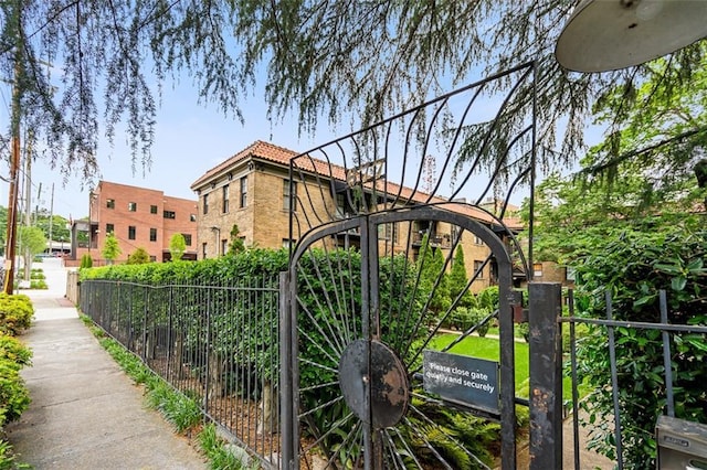view of gate with fence