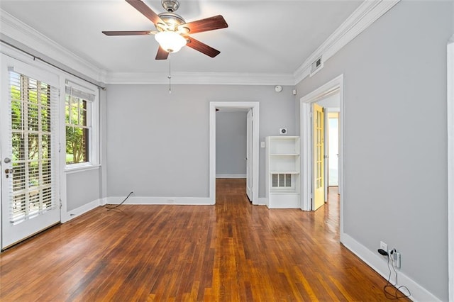 spare room featuring baseboards, a ceiling fan, hardwood / wood-style flooring, and ornamental molding