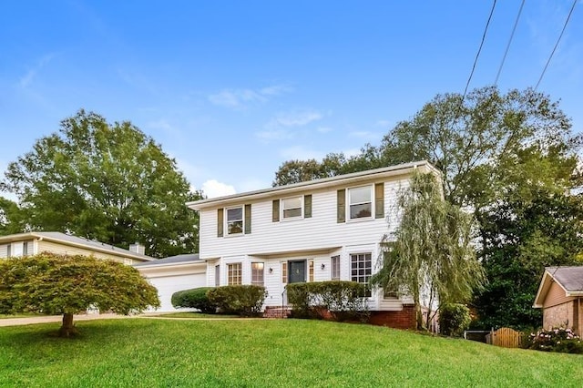 colonial inspired home with a front lawn