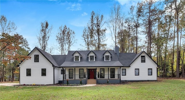 cape cod house featuring covered porch and a front yard