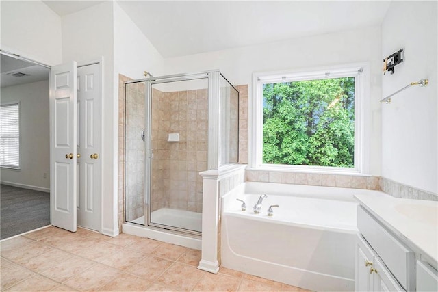full bath with a shower stall, a garden tub, tile patterned floors, and vanity