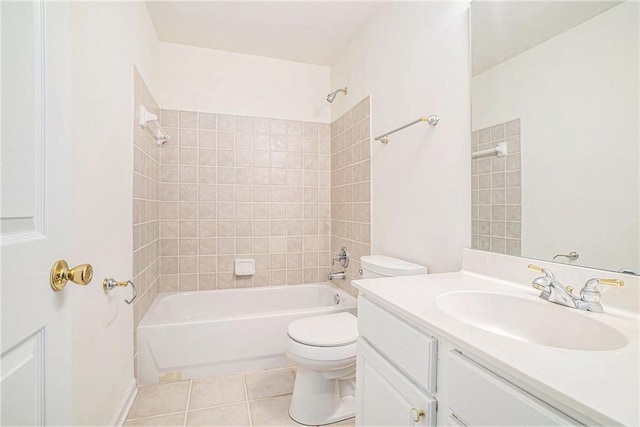 bathroom featuring toilet, tile patterned floors, washtub / shower combination, and vanity