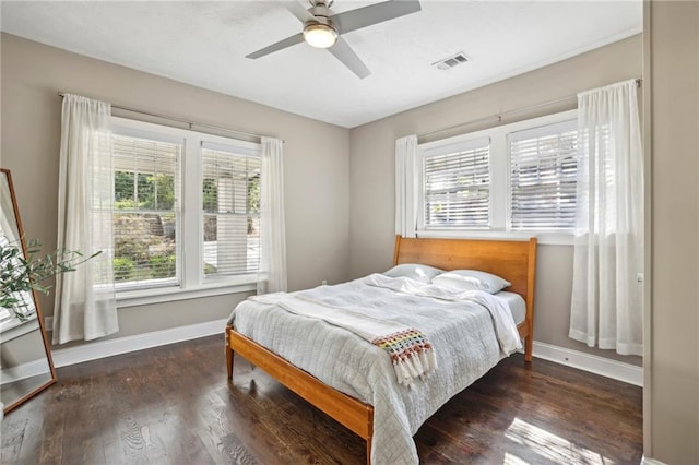 bedroom featuring ceiling fan and dark hardwood / wood-style floors