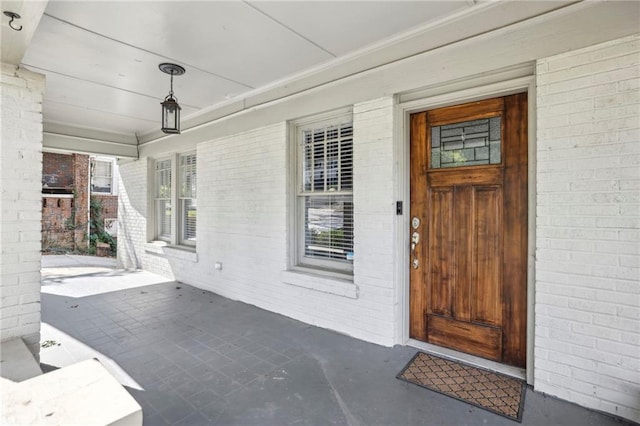 doorway to property featuring a porch