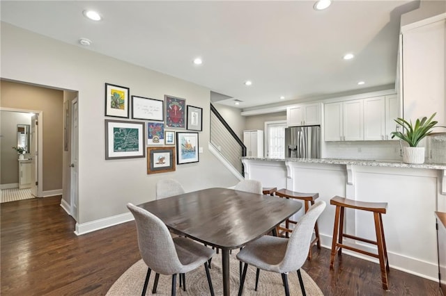 dining room featuring dark wood-type flooring