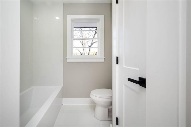 bathroom featuring tile patterned floors, shower / bathtub combination, and toilet