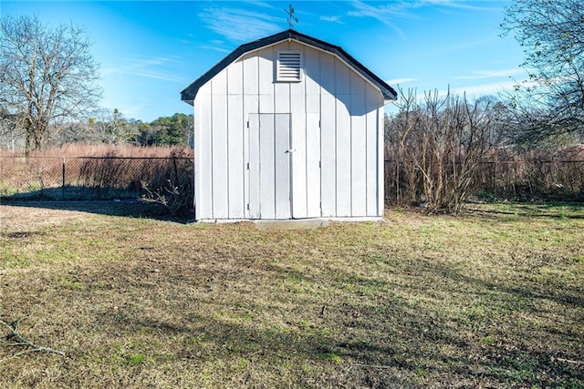 view of outbuilding with a lawn