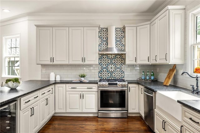 178 Mayson Ave NE, Atlanta, GA 30307 - kitchen featuring stainless steel appliances, wall chimney exhaust hood, beverage cooler, a sink, and dark countertops