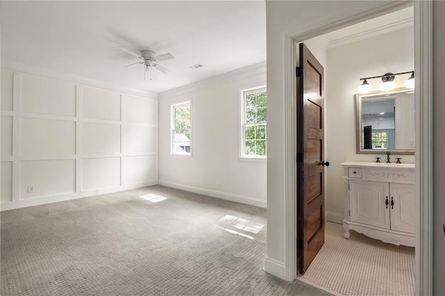 178 Mayson Ave NE, Atlanta, GA 30307 - unfurnished bedroom featuring light colored carpet, ornamental molding, a sink, baseboards, and ensuite bath