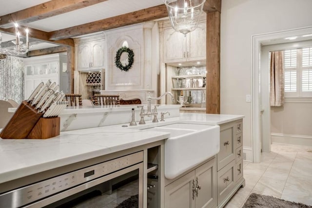 bathroom featuring beverage cooler, beam ceiling, and sink