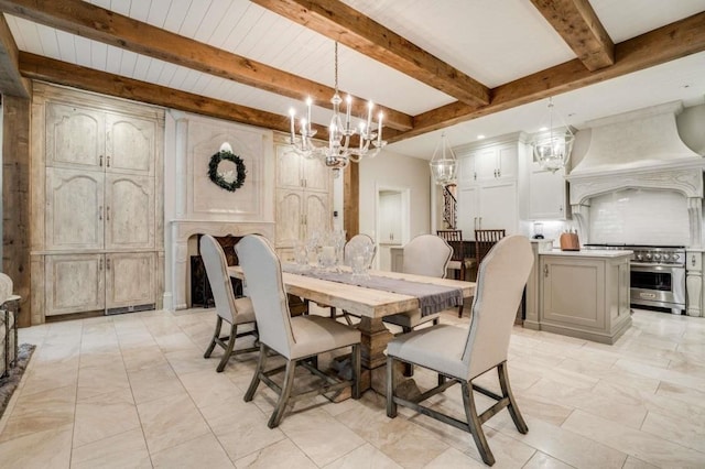 dining area featuring a chandelier and beam ceiling