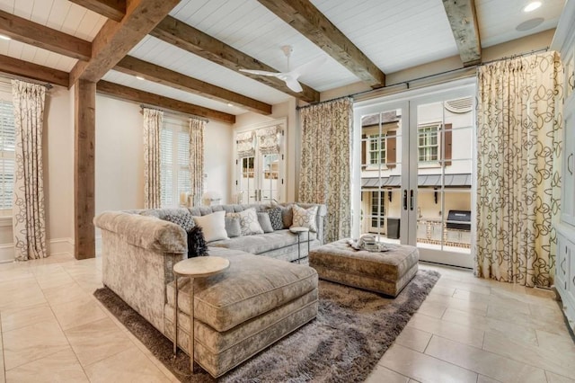 living area with beam ceiling, french doors, and ceiling fan