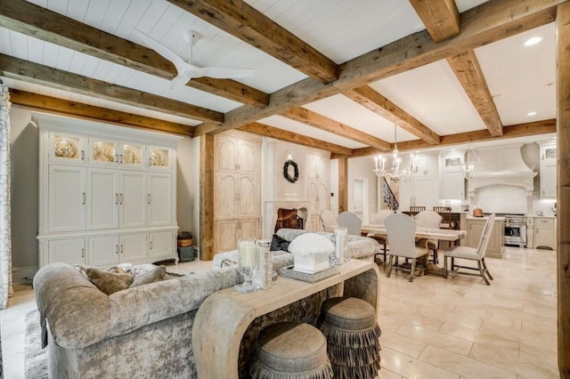 living room featuring beamed ceiling and a chandelier