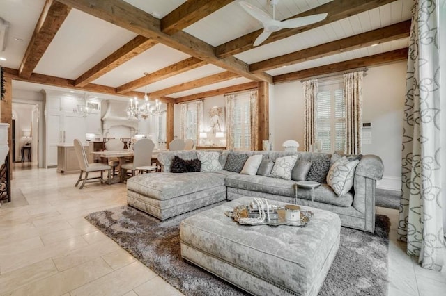 living room with beamed ceiling, light tile patterned flooring, and ceiling fan with notable chandelier