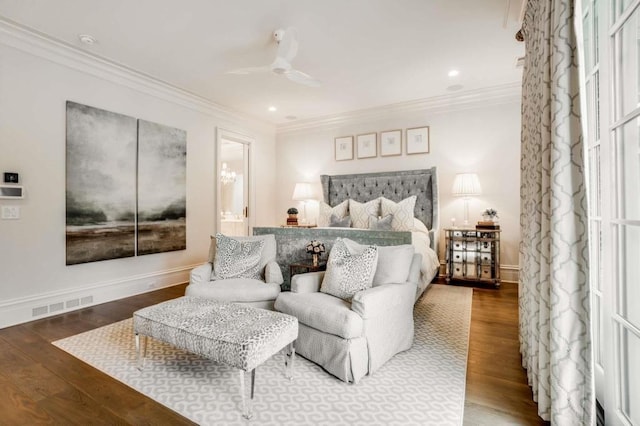 bedroom featuring crown molding, wood-type flooring, ceiling fan, and ensuite bathroom