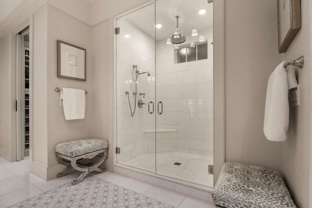 bathroom featuring an enclosed shower and tile patterned floors