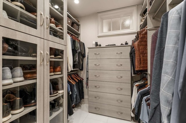 walk in closet featuring light tile patterned floors