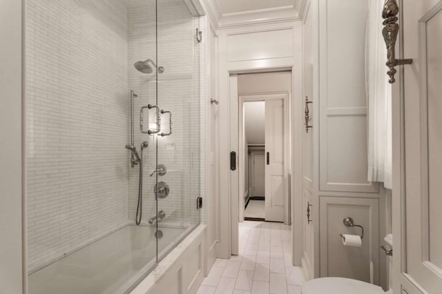 bathroom with toilet, bath / shower combo with glass door, and crown molding