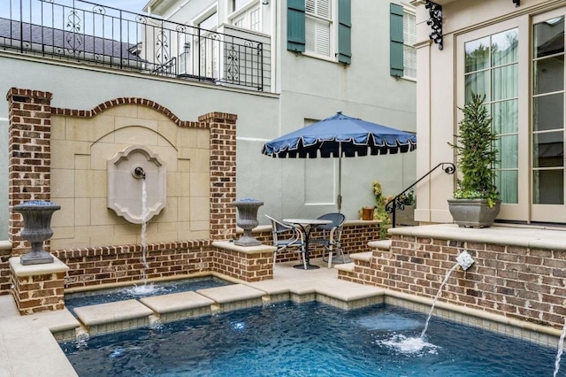 view of swimming pool with a patio