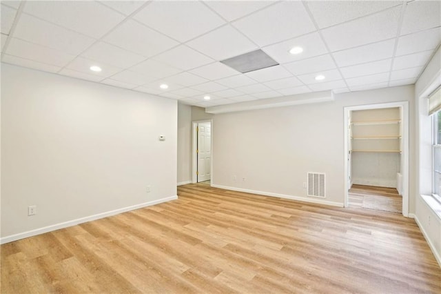 2359 Saint Kennedy Ln, Buford, GA 30518 - unfurnished room with light wood-style flooring, a paneled ceiling, built in features, and recessed lighting