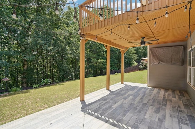 2359 Saint Kennedy Ln, Buford, GA 30518 - deck featuring a ceiling fan, a yard, and view of scattered trees
