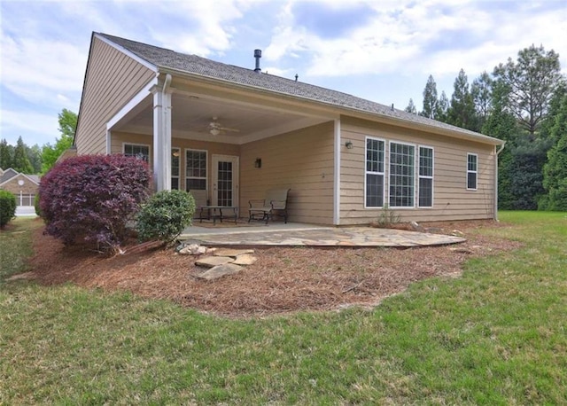 802 Dusky Sap Ct, Griffin, GA 30223 - back of property with ceiling fan, a patio area, and a lawn