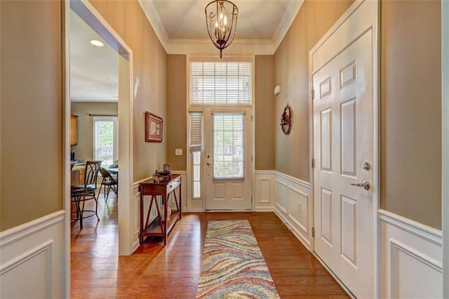 802 Dusky Sap Ct, Griffin, GA 30223 - foyer entrance featuring a decorative wall, a chandelier, ornamental molding, a wainscoted wall, and wood finished floors