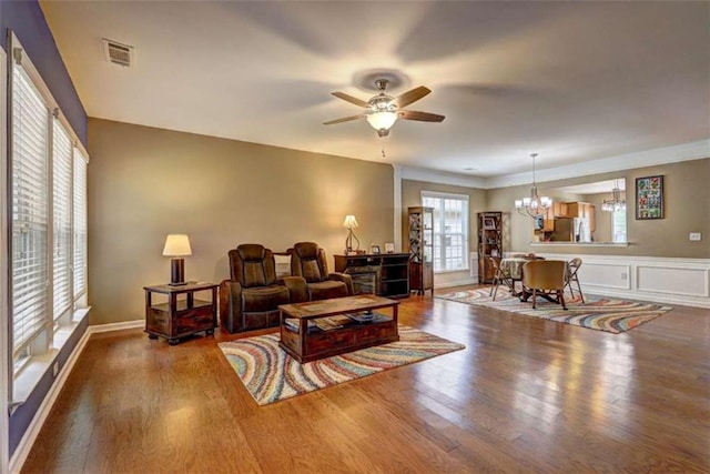 802 Dusky Sap Ct, Griffin, GA 30223 - living room with a chandelier, wood finished floors, and ceiling fan
