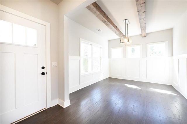 entryway featuring beam ceiling, plenty of natural light, visible vents, and dark wood-style flooring