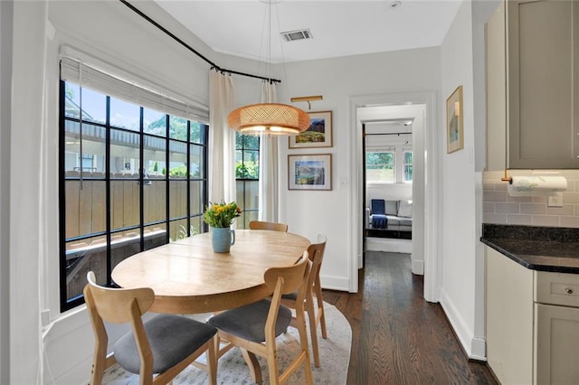 770 Barnett St NE, Atlanta, GA 30306 - dining room featuring healthy amount of natural light and dark wood-style flooring