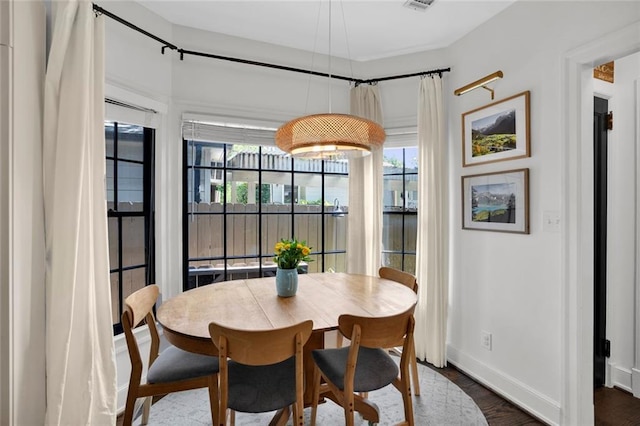 770 Barnett St NE, Atlanta, GA 30306 - dining area featuring dark wood finished floors and baseboards