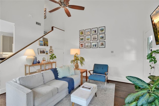 770 Barnett St NE, Atlanta, GA 30306 - living room with a towering ceiling, ceiling fan, wood finished floors, and stairs
